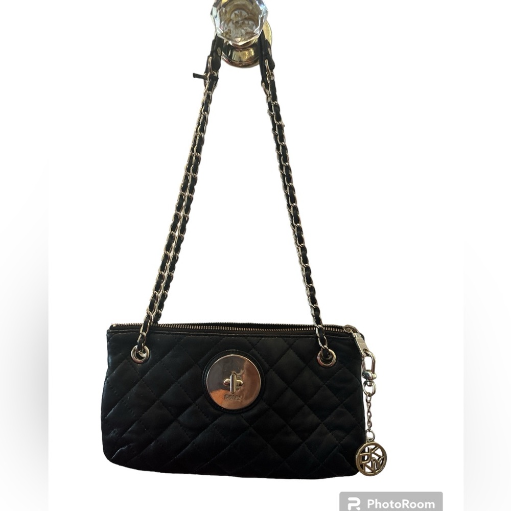 Black leather w/gold details & logo.gently used and inside is unnoticeably used!